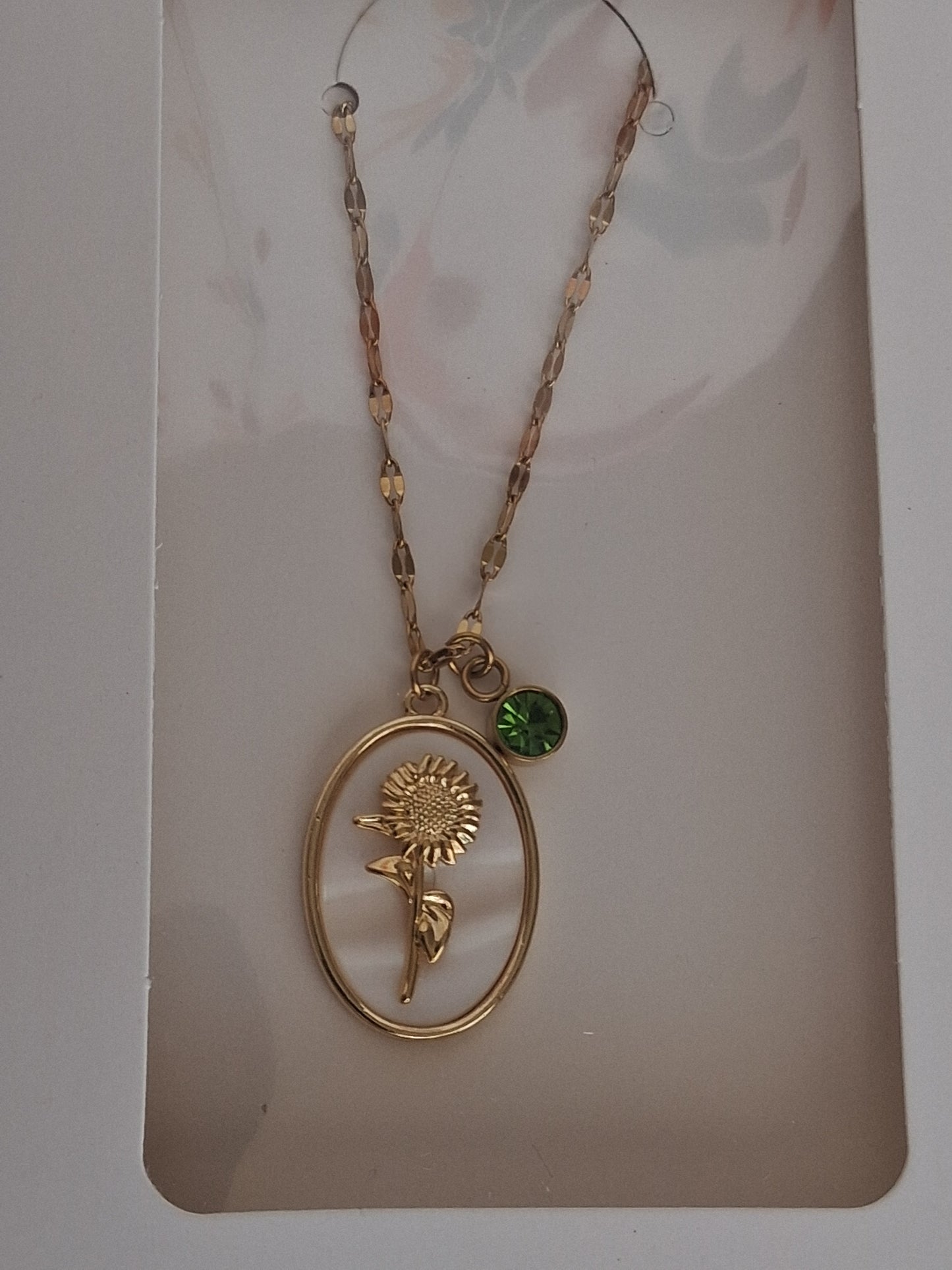 Golden sunflower & peridot charm