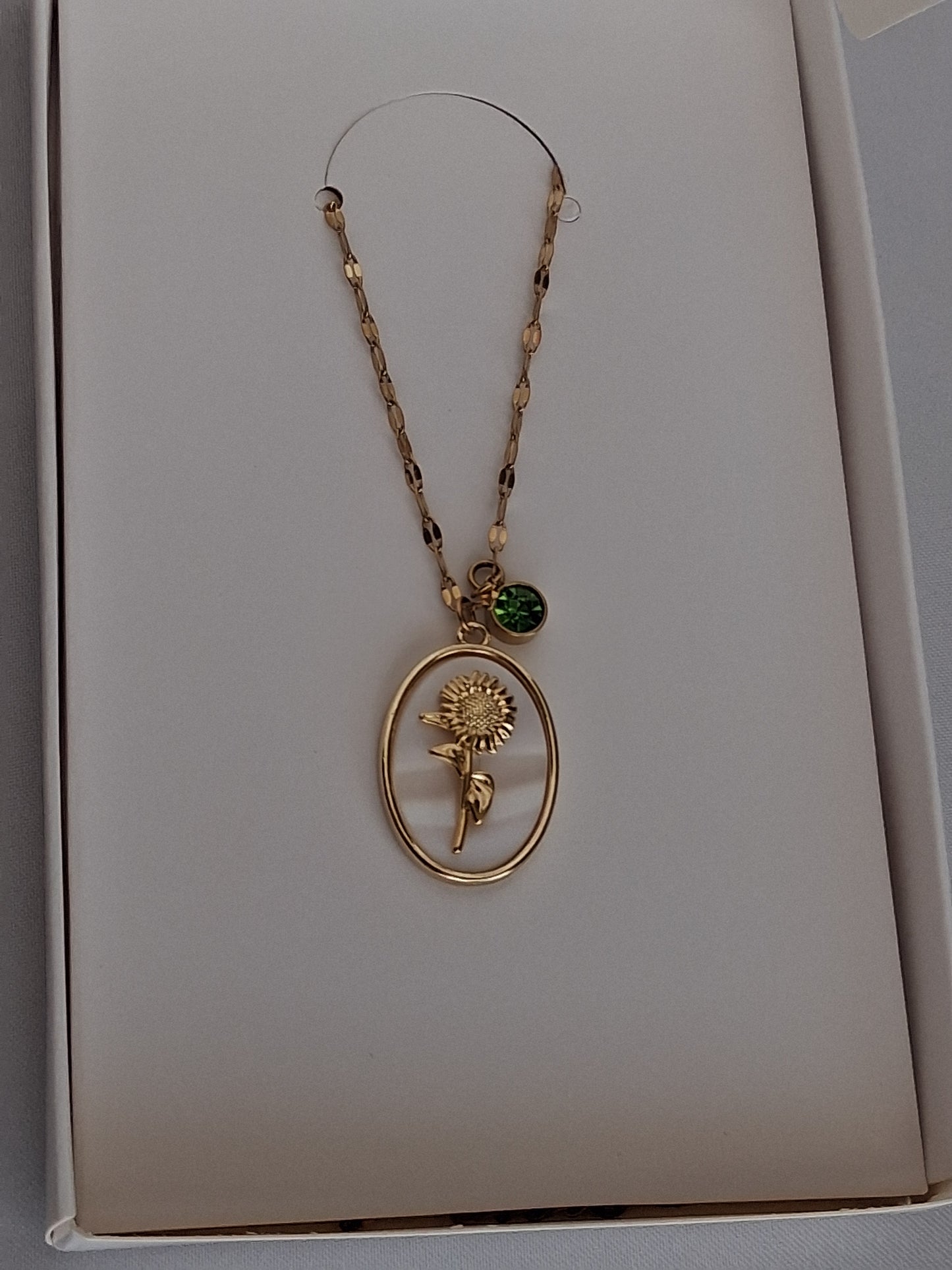 Golden sunflower & peridot charm